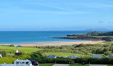 Spacious all-weather serviced pitches for tents, touring caravans, campervans and motorhomes with stunning sea-views of Lligwy Bay on Anglesey.