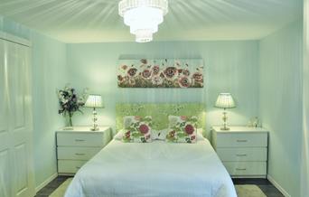 Romantic bedroom with a truly comfortable king bed and pristine bedding