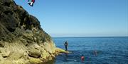 Cliff jumping with Celtic Quest Coasteering in Pembrokeshire West Wales. Jumps range from zero to a butterfly inducing 10metres!