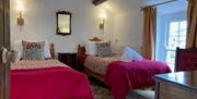 The Charming Room bedroom at Felin Crewi Cottages